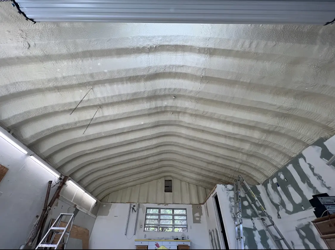 Spray polyurethane foam applied to the underside of a metal roof deck in Helena